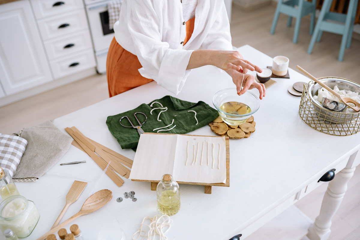 Person in White Chef Uniform Holding White Printer Paper